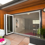 image shows Phantom Retractable Manual Wall Screens, which are custom-designed screens for large openings like doors and patios
